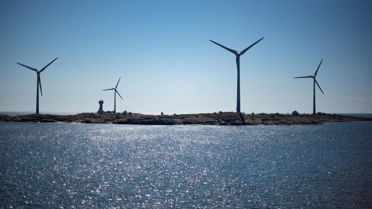 Windfarms set on deserted islands are photographed on July 29, 2017 near the Aland Islands, an autonomous archipelago belonging to Finland, half way between Finland and Sweden in the Baltic sea. OLIVIER MORIN / AFP