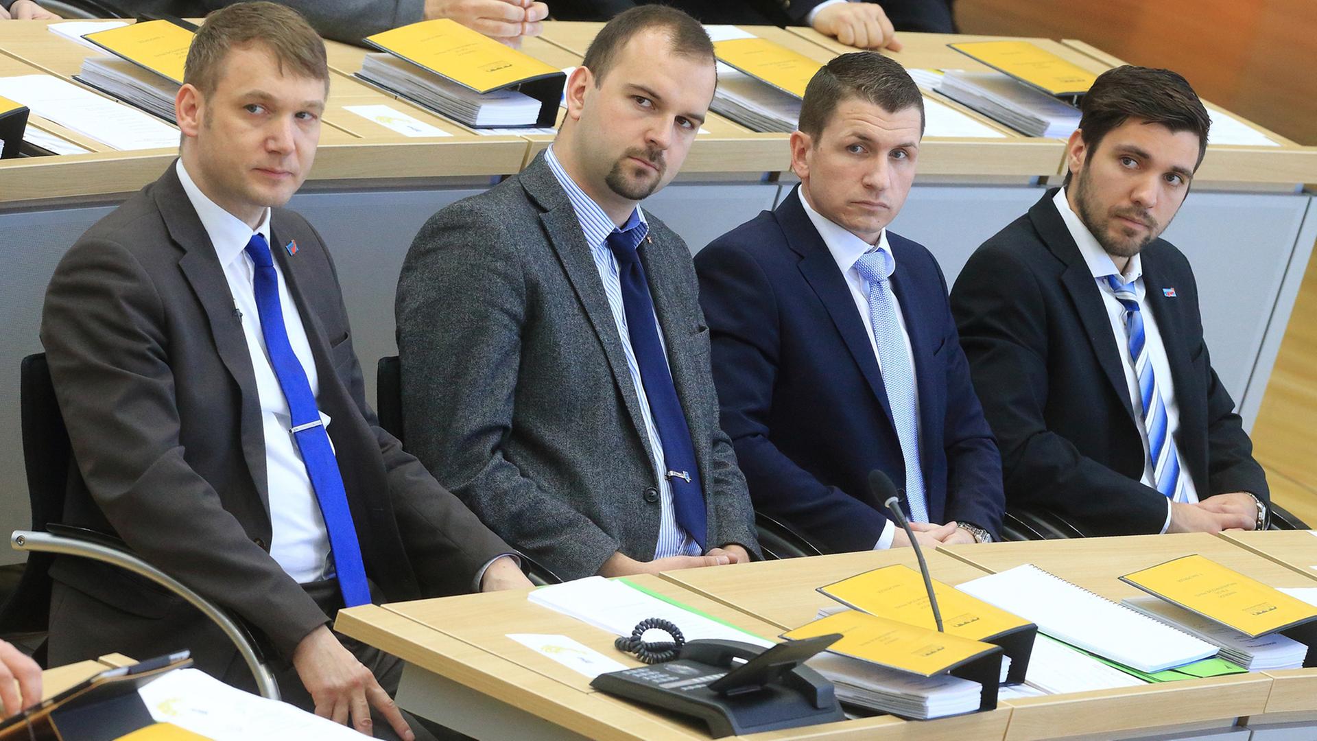 André Poggenburg (l-r), Daniel Roi, Matthias Büttner und Tobias Rausch, sitzen in der ersten Reihe der AfD-Fraktion, aufgenommen am 12.04.2016 während der Konstituierung des neuen Landtages im Plenarsaal in Magdeburg (Sachsen-Anhalt). André Poggenburg (l-r), Daniel Roi, Matthias Büttner und Tobias Rausch, sitzen in der ersten Reihe der AfD-Fraktion, aufgenommen am 12.04.2016 während der Konstituierung des neuen Landtages im Plenarsaal in Magdeburg (Sachsen-Anhalt).