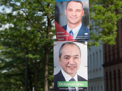 Wahlplakate mit den Fotos der beiden Oberbürgermeisterkandidaten für Görlitz: Sebastian Wippel (AfD, oben) und Octavian Ursu (CDU).