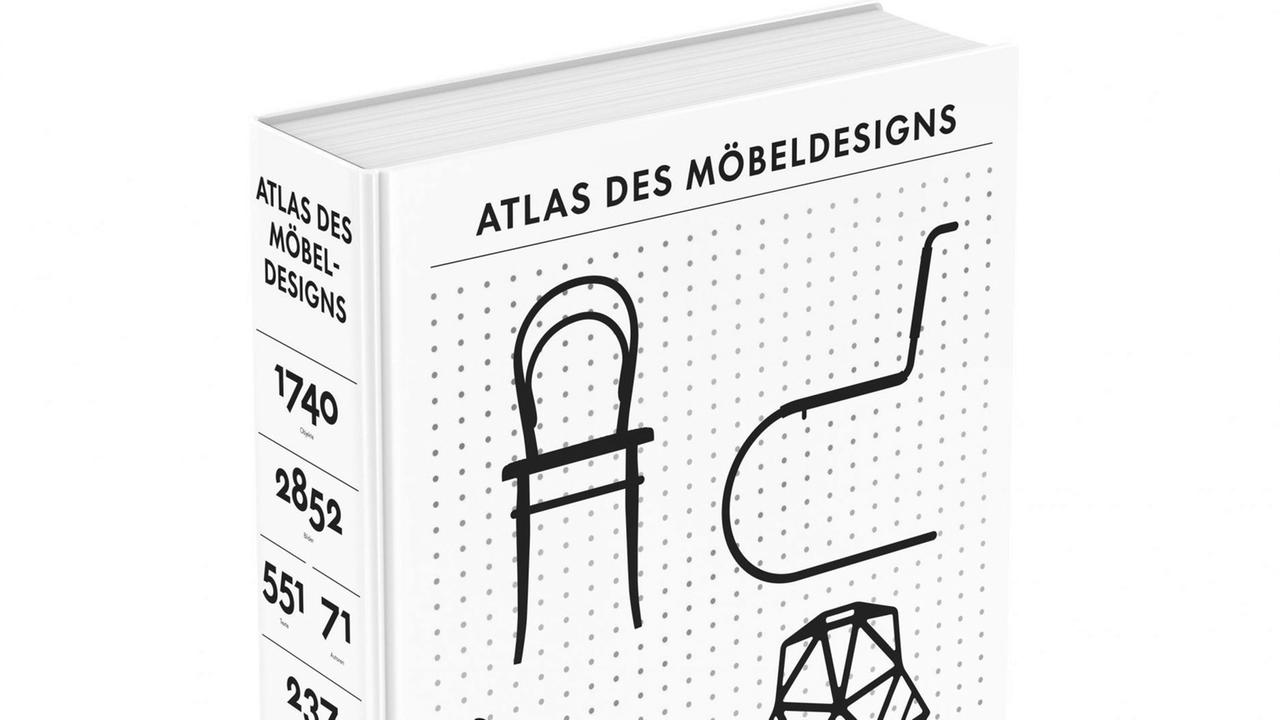 Der Atlas des Möbeldesigns steht aufrecht auf einer weißen Fläche. Das Buch ist geschlossen.