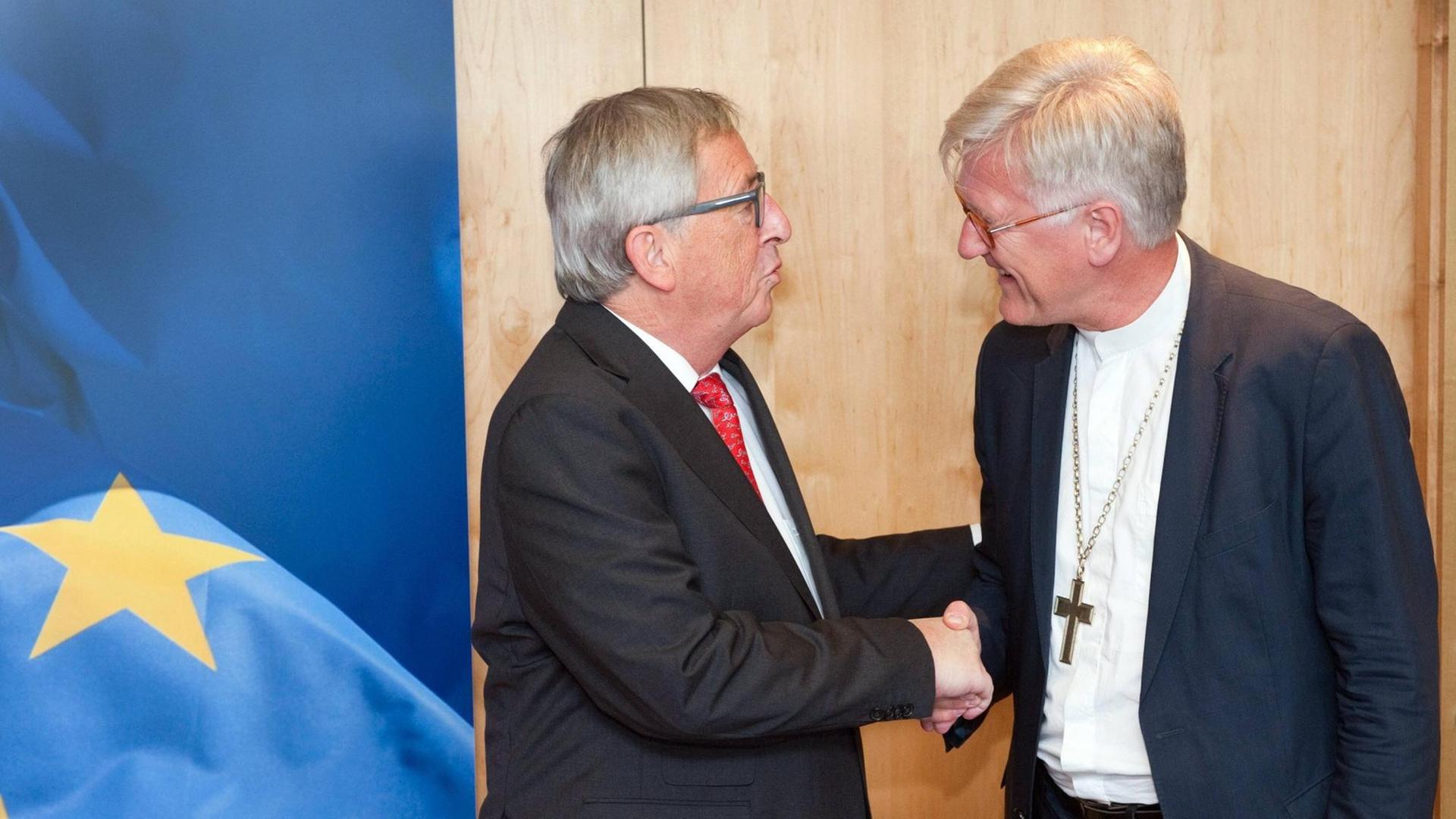 Die Evangelischen Kirche in Deutschland (EKD) ist eine der vier Kirchen mit einem ständigen Büro in Brüssel. Hier ihr Ratsvorsitzender Heinrich Bedford-Strohm mit Kommissionspräsident Jean-Claude Juncker Die Evangelischen Kirche in Deutschland (EKD) ist eine der vier Kirchen mit einem ständigen Büro in Brüssel. Hier ihr Ratsvorsitzender Heinrich Bedford-Strohm mit Kommissionspräsident Jean-Claude Juncker