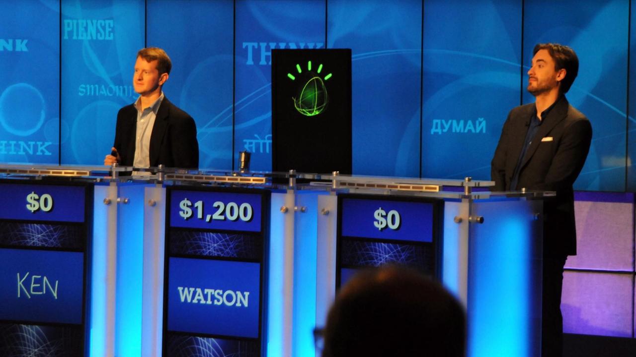 IBMs Watson, Ken Jennings und Brad Rutter im Jeopardy Studio. IBMs Watson, Ken Jennings und Brad Rutter im Jeopardy Studio.