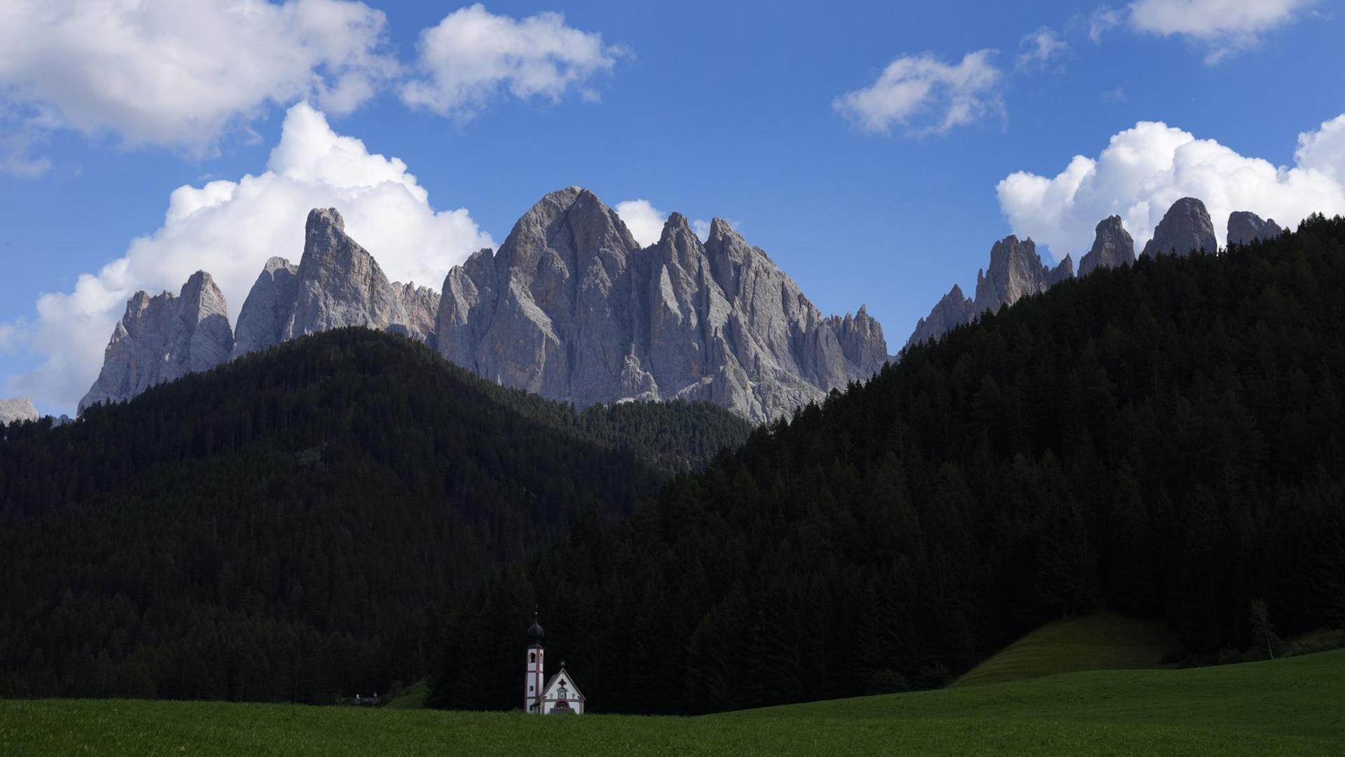 Clouds hang over the St. Johann chapel and the Dolomites mountains in St. Maddalena, St. Magdalena, in Val di Funes (Villnoess), in northern Italian province of South Tyrol, Italy, Friday, Aug. 20, 2021. (AP Photo/Matthias Schrader) Clouds hang over the St. Johann chapel and the Dolomites mountains in St. Maddalena, St. Magdalena, in Val di Funes (Villnoess), in northern Italian province of South Tyrol, Italy, Friday, Aug. 20, 2021. (AP Photo/Matthias Schrader)
