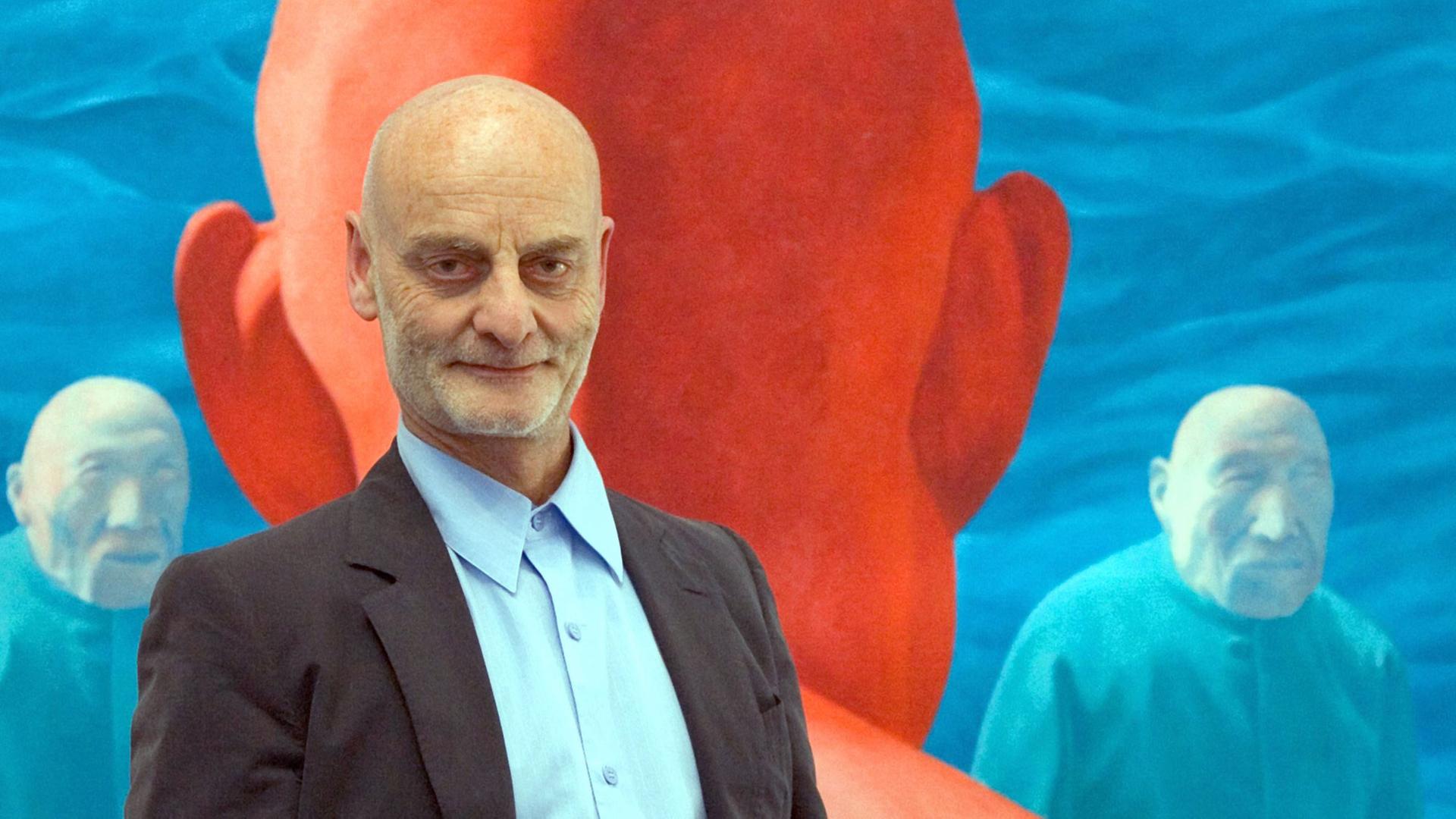 Uli Sigg standing in front of a painting of chinese artist Fang Lijun in the exhibition Mahjong at the museum of modern art in Bern, Switzerland, June 11, 2005. The exhibition is presenting contemporary chinese art of the Uli Sigg collection. Uli Sigg holds the worldwide biggest collection of chinese art. The exhibition Mahjong is the first show of his collection. Uli Sigg standing in front of a painting of chinese artist Fang Lijun in the exhibition Mahjong at the museum of modern art in Bern, Switzerland, June 11, 2005. The exhibition is presenting contemporary chinese art of the Uli Sigg collection. Uli Sigg holds the worldwide biggest collection of chinese art. The exhibition Mahjong is the first show of his collection.