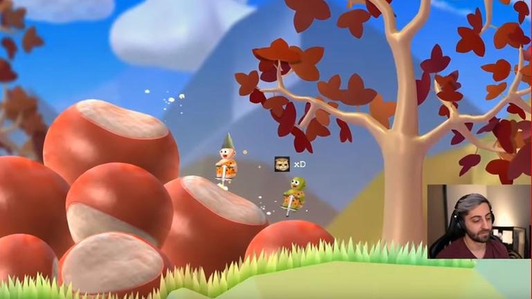 Ein Screenshot zeigen den Gamer Giantwaffle während eines Computerspiels mit zwei kleinen Figuren auf Pogo-Sticks in einer animierten Herbstumgebung mit Kastanien. Ein Screenshot zeigen den Gamer Giantwaffle während eines Computerspiels mit zwei kleinen Figuren auf Pogo-Sticks in einer animierten Herbstumgebung mit Kastanien.