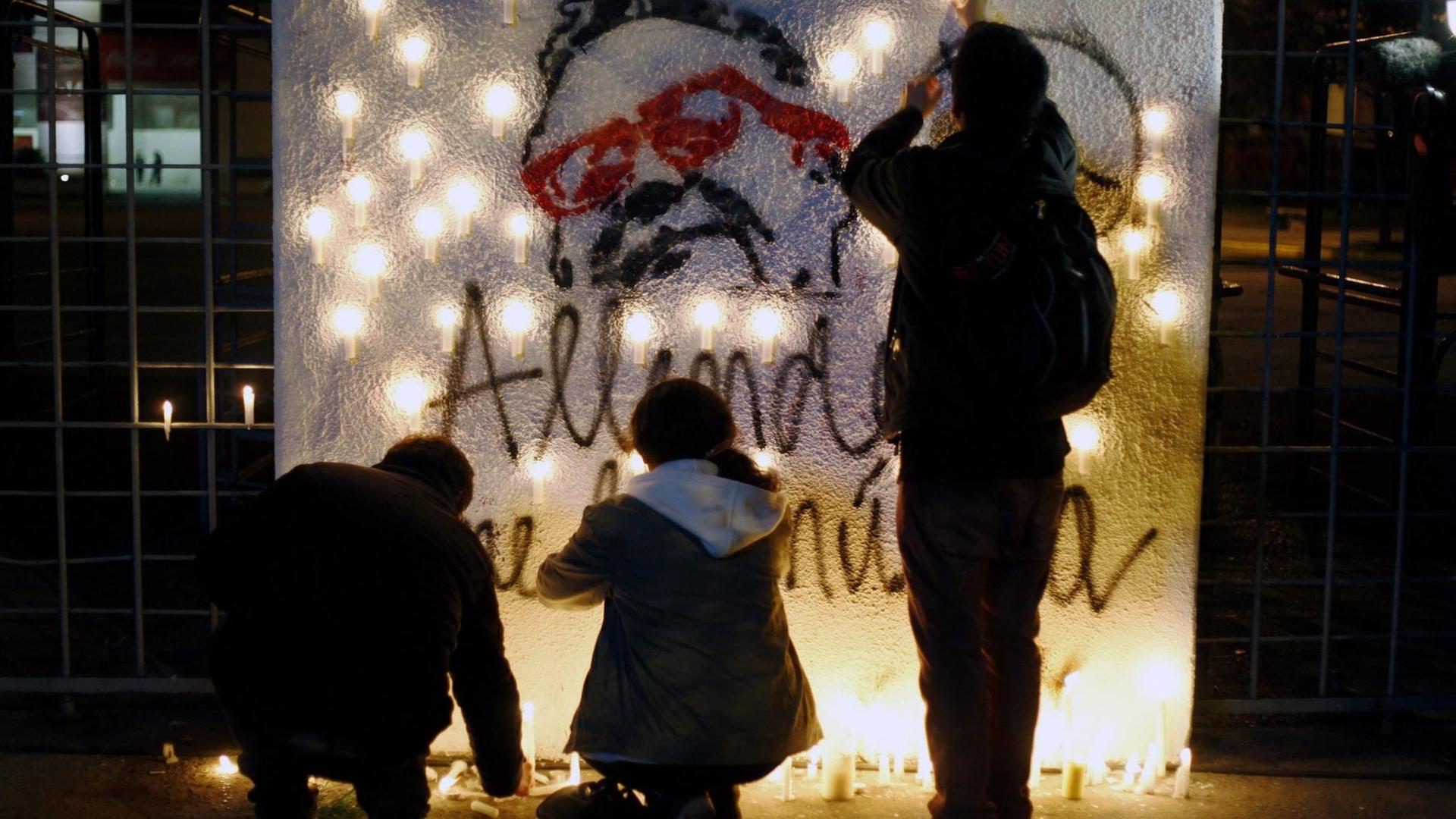 A group of people light candles at Estadio Nacional in Santiago, Chile, 11 September 2014. Chileans commemorated the 41st anniversary of the military coup d'etat by General Augusto Pinochet against the back then President Salvador Allende.