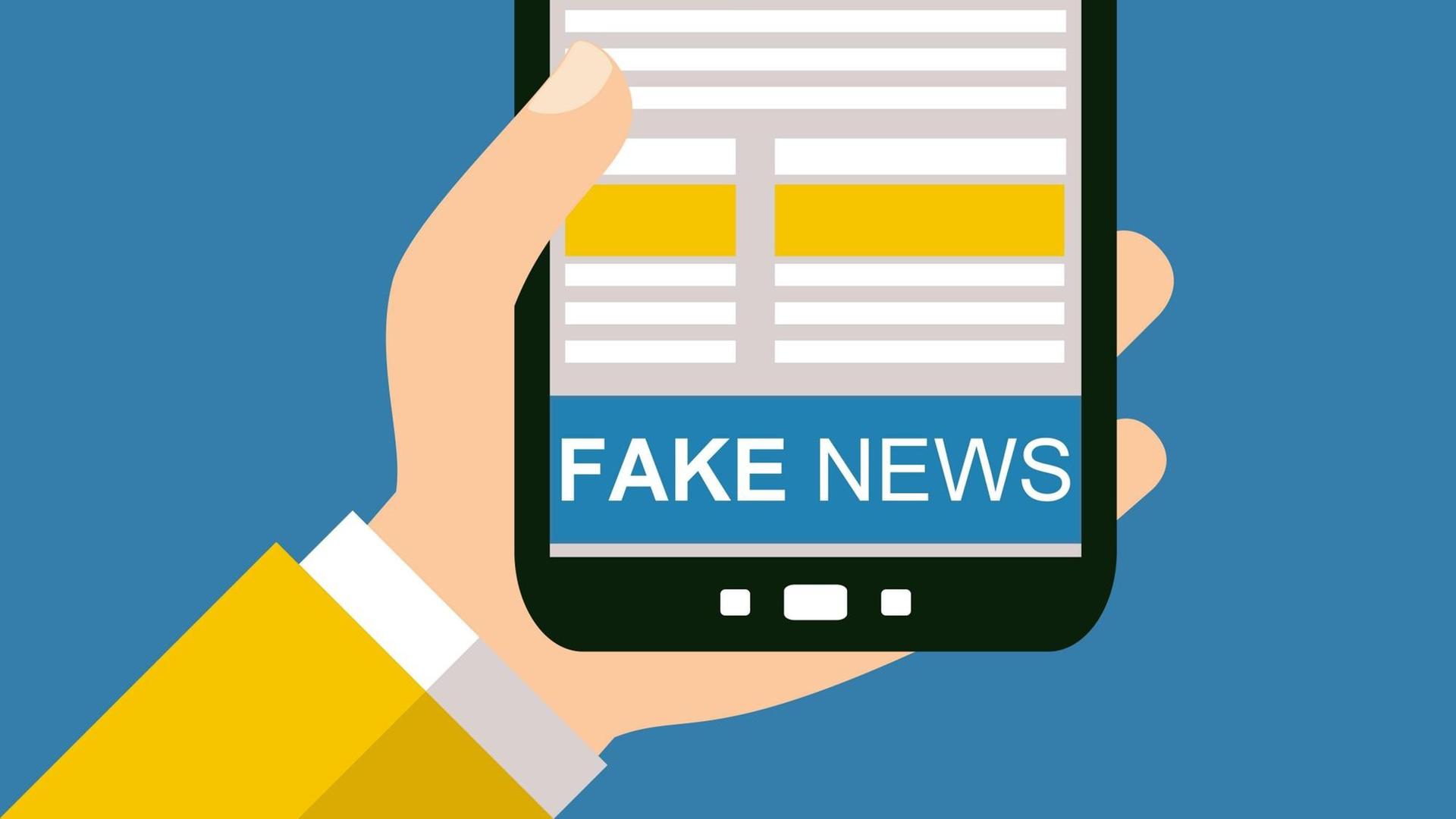 Illustration: 'Fake news' steht auf dem Display eines Smartphone. Illustration: 'Fake news' steht auf dem Display eines Smartphone.