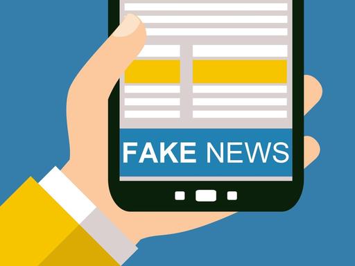 Illustration: 'Fake news' steht auf dem Display eines Smartphone.
