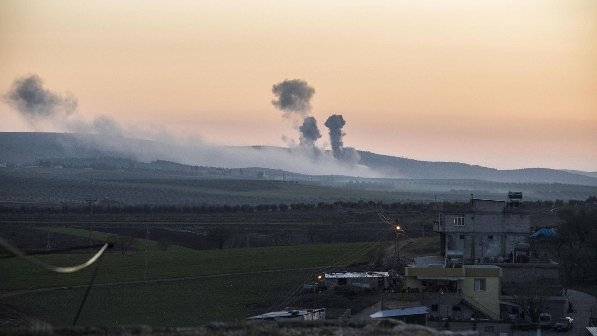 A plume of smoke rises on the air from inside Syria, as seen from the outskirts of the border town of Kilis, Turkey, Saturday, Jan. 20, 2018. Turkish jets have begun an aerial offensive against the Syrian enclave of Afrin. Turkey s military fired into the enclave in north Syria for a second day on Saturday. A plume of smoke rises on the air from inside Syria, as seen from the outskirts of the border town of Kilis, Turkey, Saturday, Jan. 20, 2018. Turkish jets have begun an aerial offensive against the Syrian enclave of Afrin. Turkey s military fired into the enclave in north Syria for a second day on Saturday.