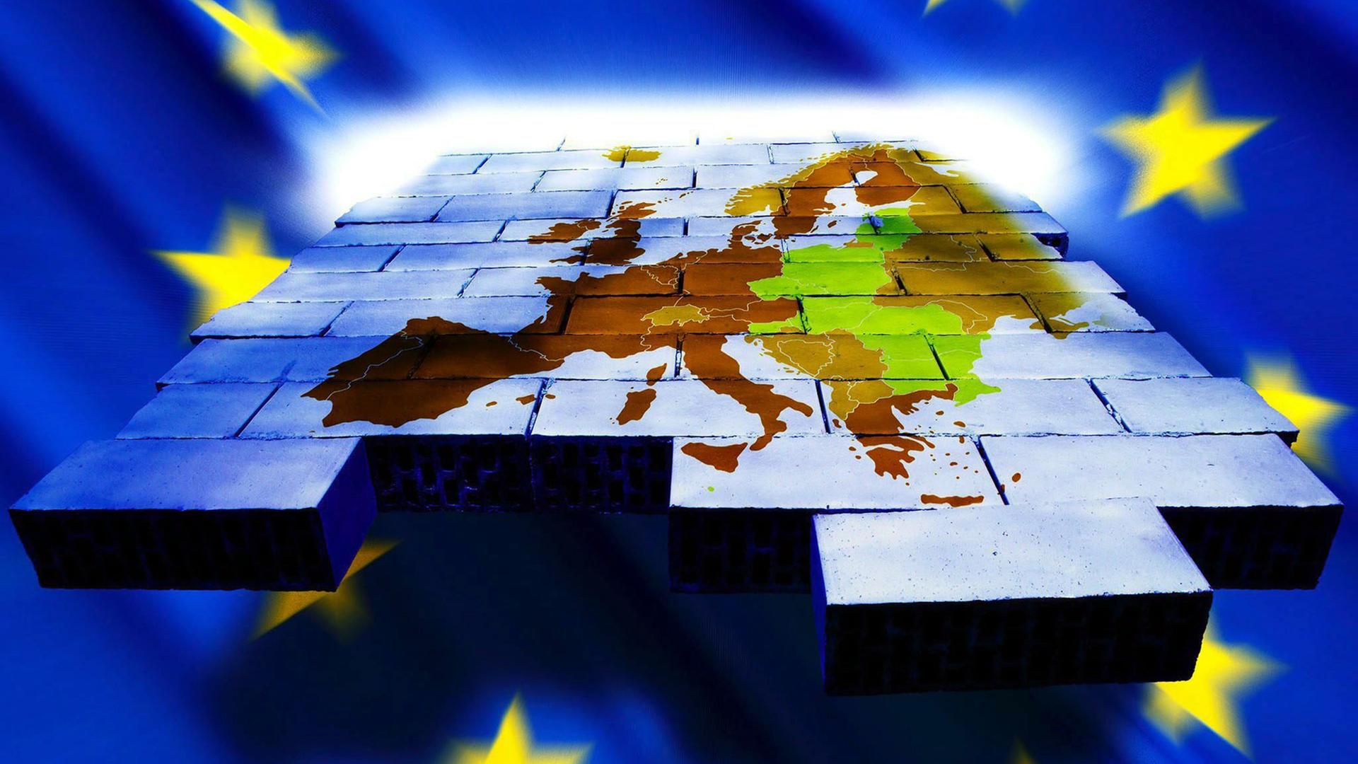 Eine Landkarte der EU-Mitgliedsländer auf einer Wand aus Bausteinen, umrahmt von der EU-Flagge. Eine Landkarte der EU-Mitgliedsländer auf einer Wand aus Bausteinen, umrahmt von der EU-Flagge.