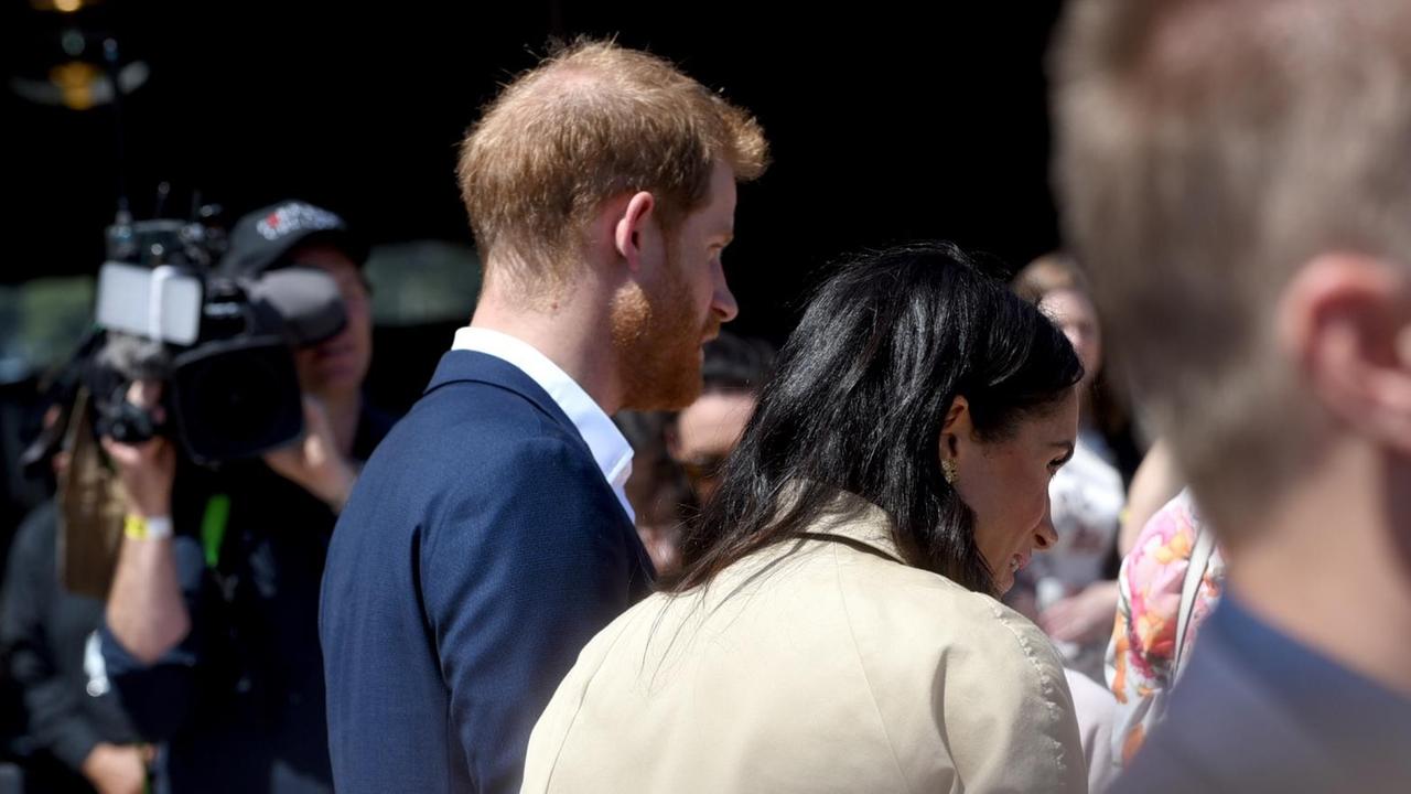 Prinz Harry (l) und Herzogin Meghan in Australien. Prinz Harry (l) und Herzogin Meghan in Australien.