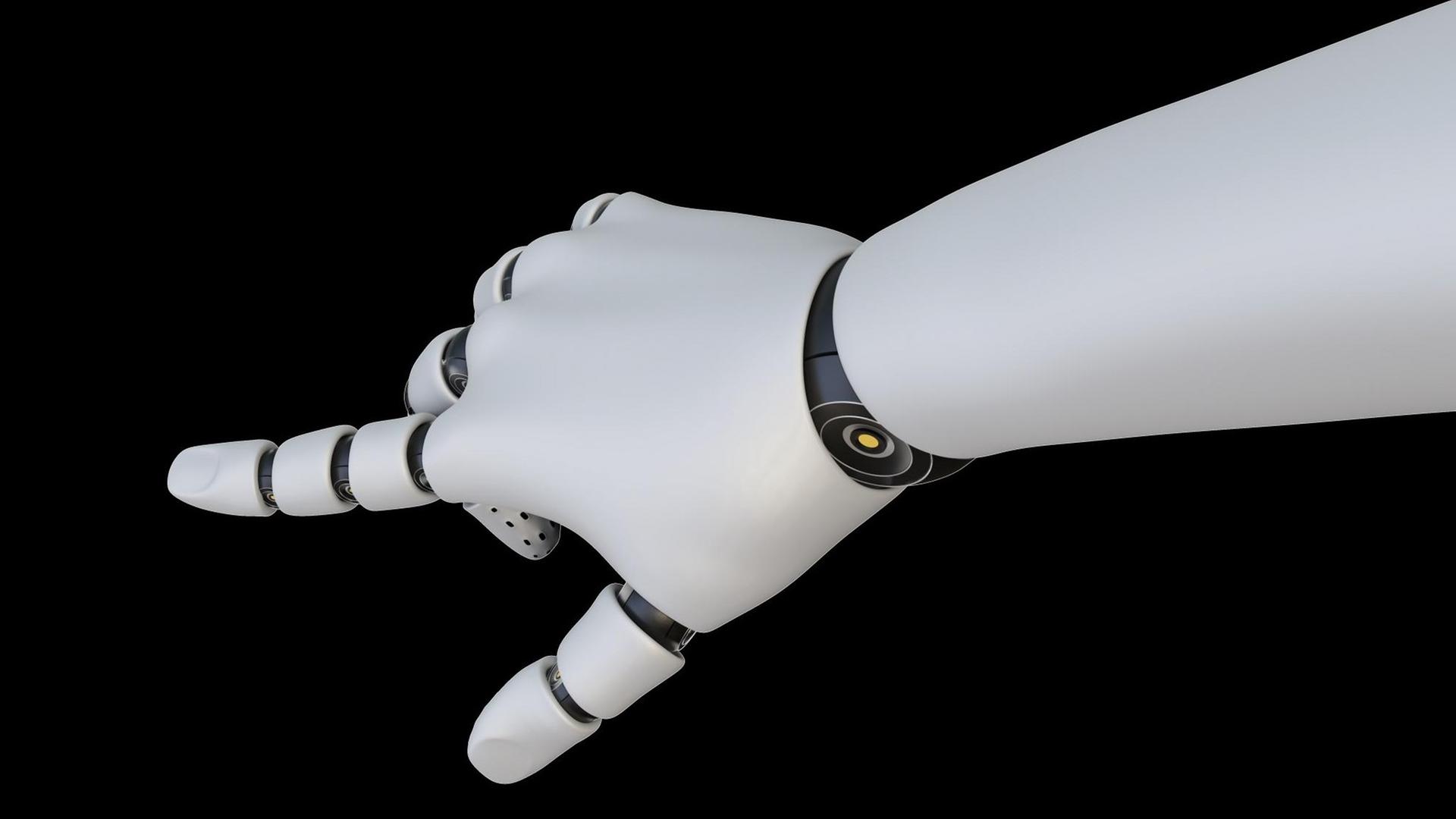 Eine weiße Roboterhand hat ihren Zeigefinger ausgestreckt. Eine weiße Roboterhand hat ihren Zeigefinger ausgestreckt.