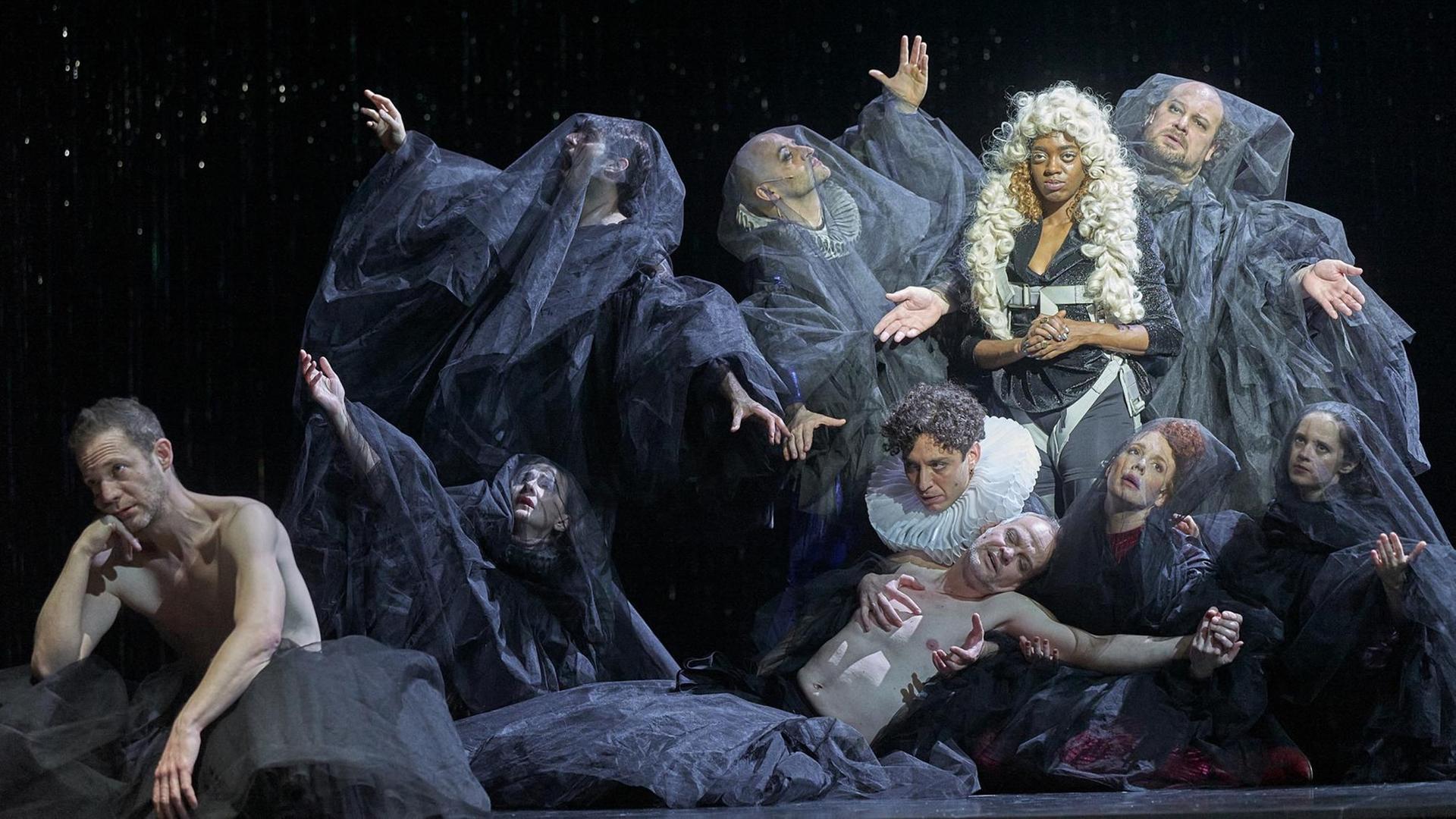 Szenenbild der Inszenierung "THIS IS VENICE" in der Regie von Sebastian Nübling am Wiener Burgtheater. In der Gruppe befinden sich die SchauspielerInnen: (vorne) Itay Tiran, Sylvie Rohrer, Mehmet Ateşçi, Dietmar König, Stefanie Dvorak, Maresi Riegner, (hinten) Bardo Böhlefeld, Gunther Eckes, Stacyian Jackson, Rainer Galke Szenenbild der Inszenierung "THIS IS VENICE" in der Regie von Sebastian Nübling am Wiener Burgtheater. In der Gruppe befinden sich die SchauspielerInnen: (vorne) Itay Tiran, Sylvie Rohrer, Mehmet Ateşçi, Dietmar König, Stefanie Dvorak, Maresi Riegner, (hinten) Bardo Böhlefeld, Gunther Eckes, Stacyian Jackson, Rainer Galke