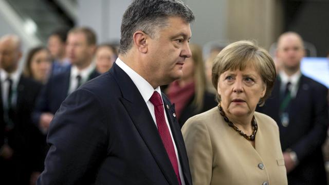Ukraine's President Petro Poroshenko and German Chancellor Angela during a meeting in Riga. Mikhail Palinchak/RIA Novosti
