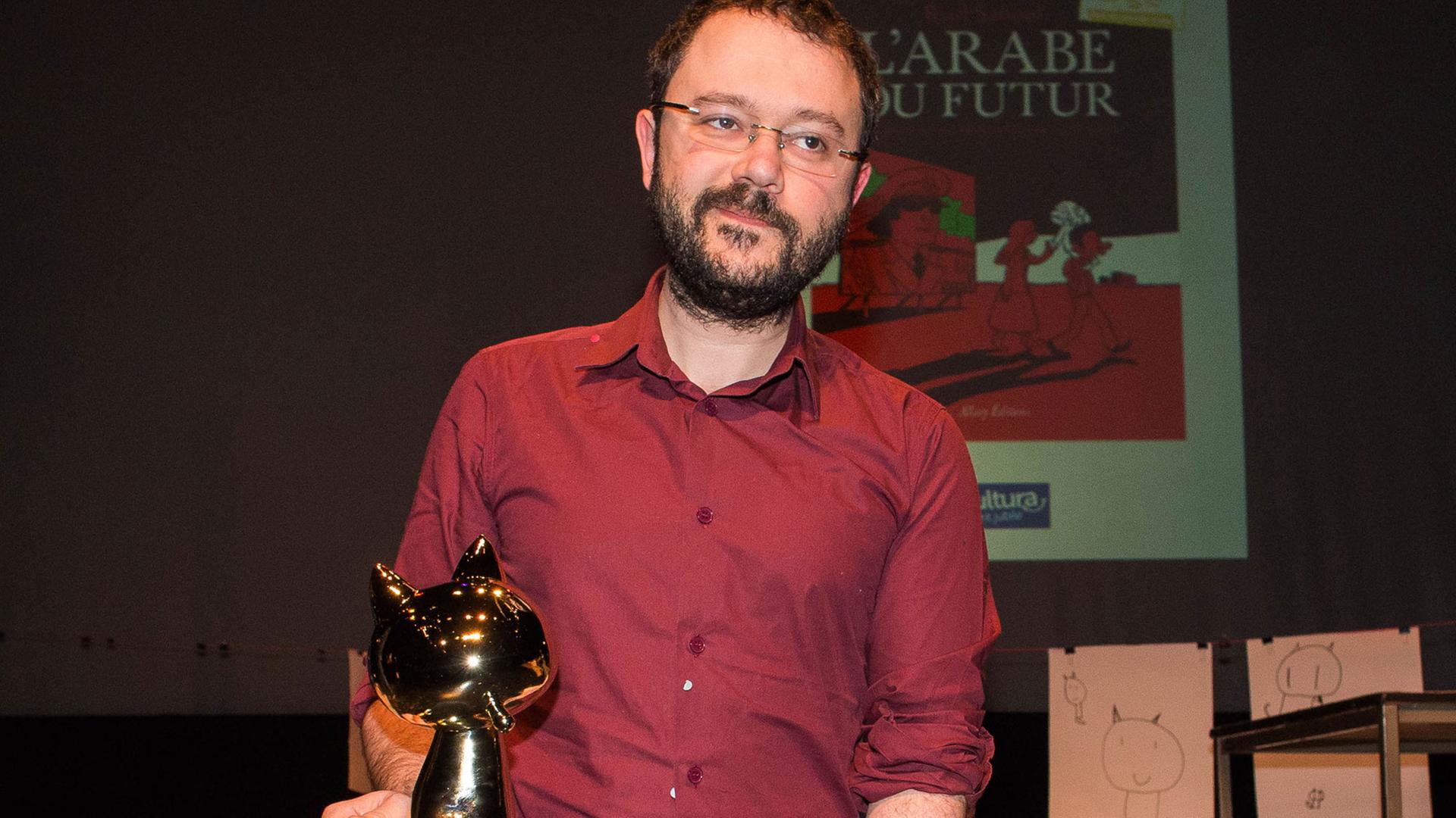 Riad Sattouf erhält am 1.2.2015 beim wichtigsten französischen Comic-Festival in Angoulême für "Der Araber von morgen" den Preis für das Album des Jahres. Riad Sattouf erhält am 1.2.2015 beim wichtigsten französischen Comic-Festival in Angoulême für "Der Araber von morgen" den Preis für das Album des Jahres.