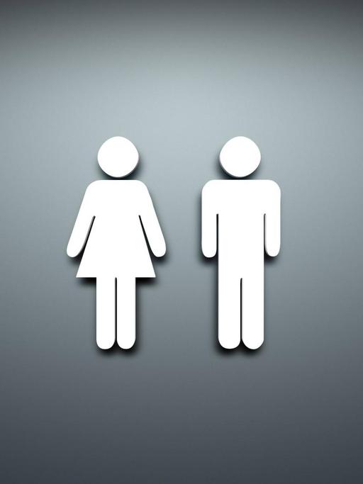 Ein typisches Toilettensymbol vor grauem Hintergrund.