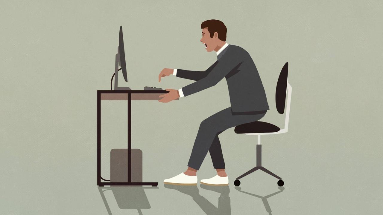 Ein Mann im Anzug sitzt mit aufgeregtem Gesichtsausdruck an seinem Schreibtisch und tippt mit übertriebener Geste auf die Tastatur vor sich.