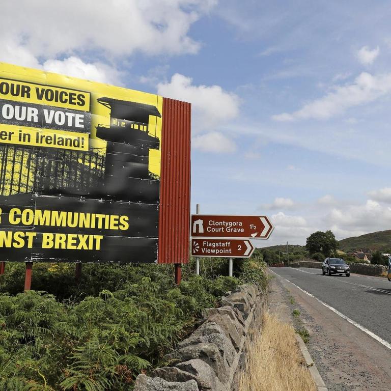 Anti Brexit billboards are seen on the northern side of the border between Newry, in Northern Ireland, and Dundalk, in the Republic of Ireland, on Wednesday, July 18, 2018. British Prime Minister Theresa May is scheduled to make her first visit to the Irish border since the Brexit referendum later this week. (Niall Carson/PA via AP)
