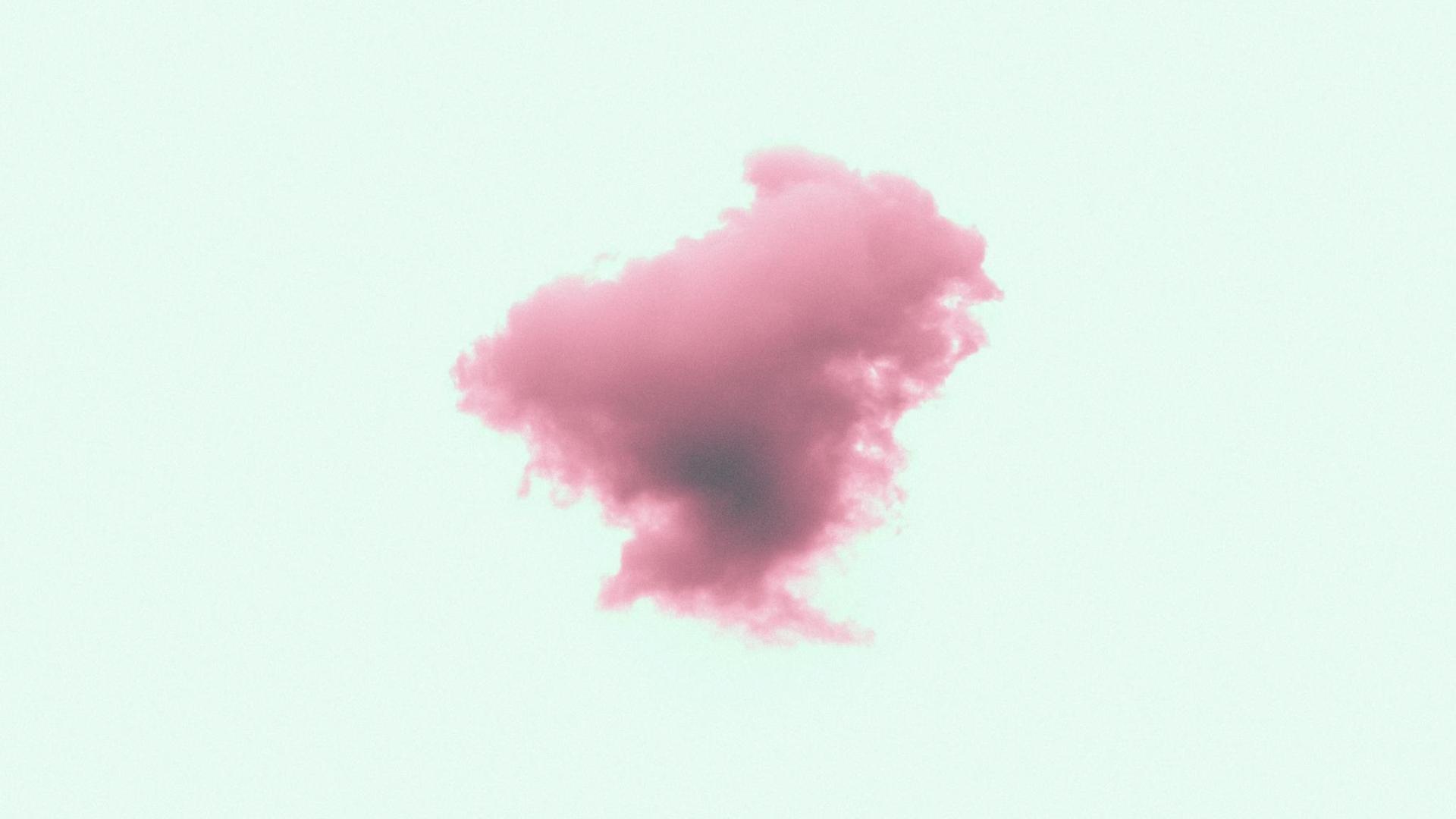 Surreales Bild einer pinken Wolke vor türkisem Hintergrund.