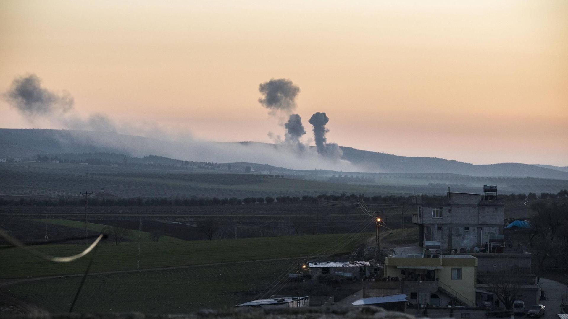 A plume of smoke rises on the air from inside Syria, as seen from the outskirts of the border town of Kilis, Turkey, Saturday, Jan. 20, 2018. Turkish jets have begun an aerial offensive against the Syrian enclave of Afrin. Turkey s military fired into the enclave in north Syria for a second day on Saturday. A plume of smoke rises on the air from inside Syria, as seen from the outskirts of the border town of Kilis, Turkey, Saturday, Jan. 20, 2018. Turkish jets have begun an aerial offensive against the Syrian enclave of Afrin. Turkey s military fired into the enclave in north Syria for a second day on Saturday.