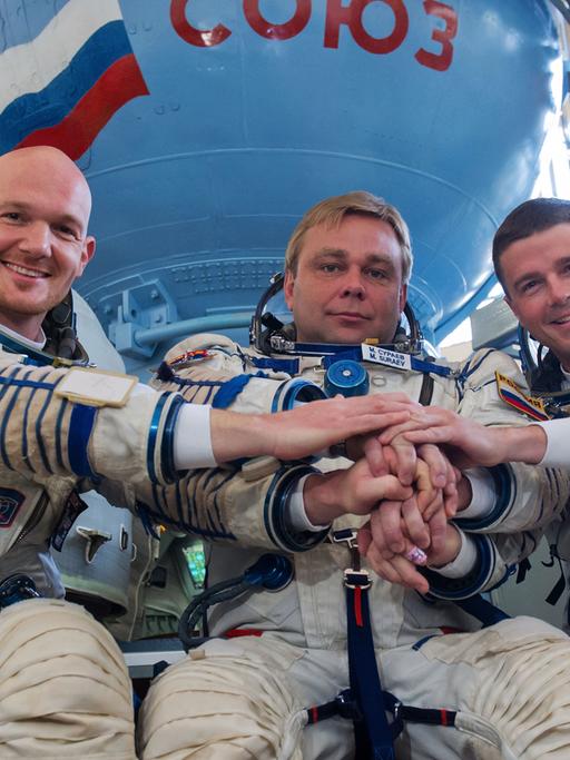 Die ISS-Besatzung Alexander Gerst, Maxim Surayev, Reid Wiseman