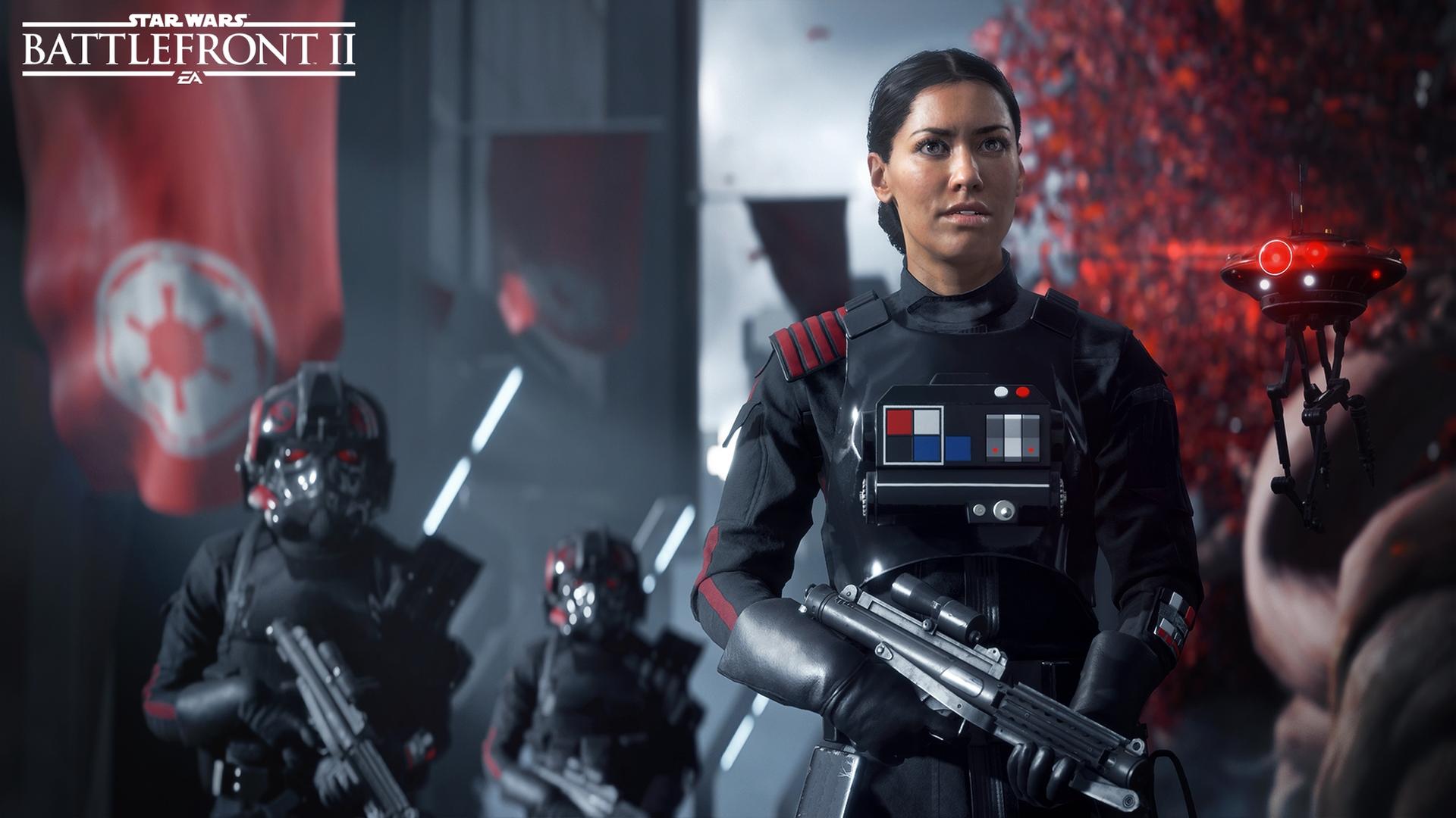 Screenshot aus Star Wars Battlefront 2 - eine imperiale Soldatin steht mit ihren unbehelmten Kollegen in Bereitschaft Screenshot aus Star Wars Battlefront 2 - eine imperiale Soldatin steht mit ihren unbehelmten Kollegen in Bereitschaft
