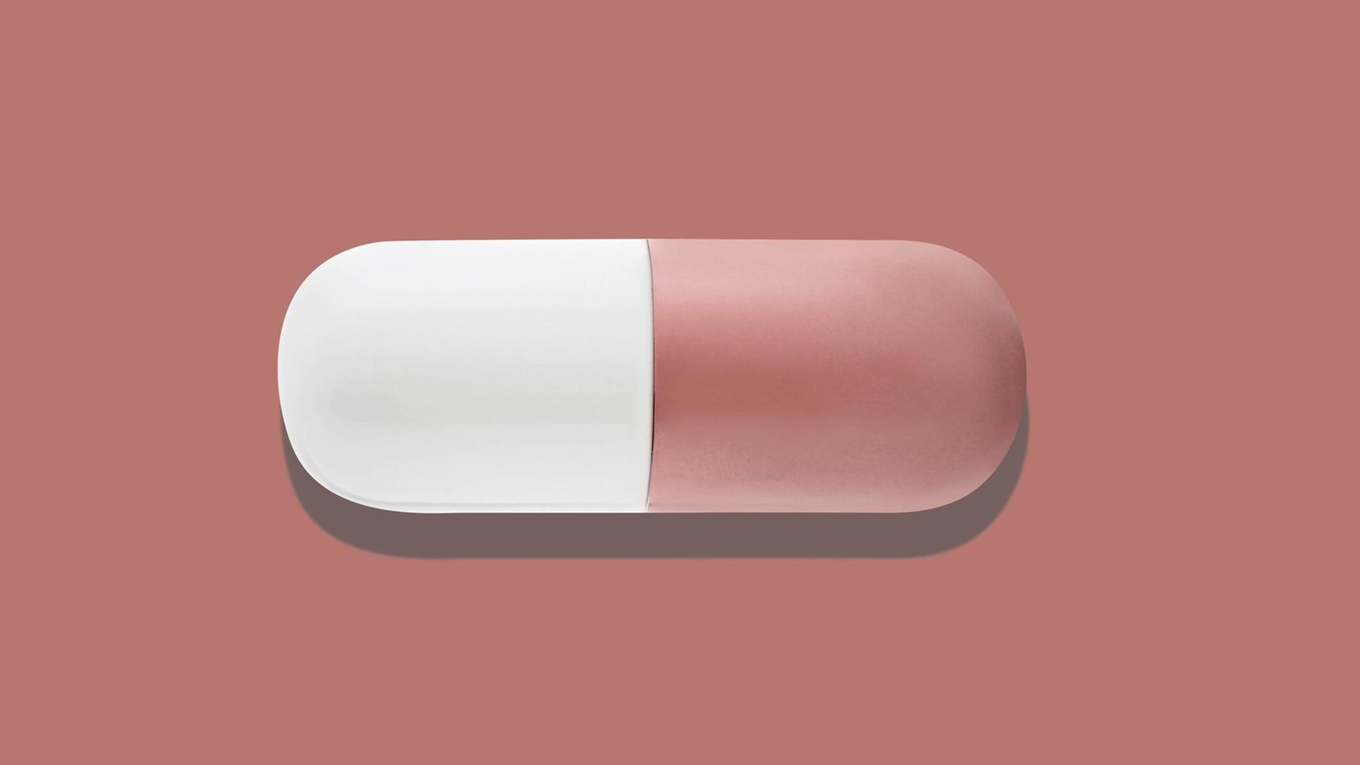 Die Illustration zeigt eine rot-weiße Kapsel Die Illustration zeigt eine rot-weiße Kapsel