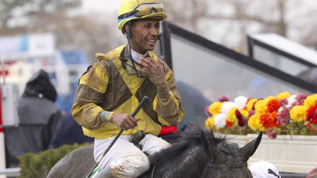 Nov. 28, 2015 - New York, New York, U.S - On a rainy day highlighted by the Cigar Mile Handicap at Aqueduct, jockey KENDRICK CARMOUCHE, seen here heading off the track aboard PANGBURN immediately after the 7th race (the Comely Stakes) earlier that afternoon, smiles despite all the sand and mud residue from their work. Horse Racing 2015 - Cigar Mile Handicap - ZUMAr112 Nov. 28, 2015 - New York, New York, U.S - On a rainy day highlighted by the Cigar Mile Handicap at Aqueduct, jockey KENDRICK CARMOUCHE, seen here heading off the track aboard PANGBURN immediately after the 7th race (the Comely Stakes) earlier that afternoon, smiles despite all the sand and mud residue from their work. Horse Racing 2015 - Cigar Mile Handicap - ZUMAr112