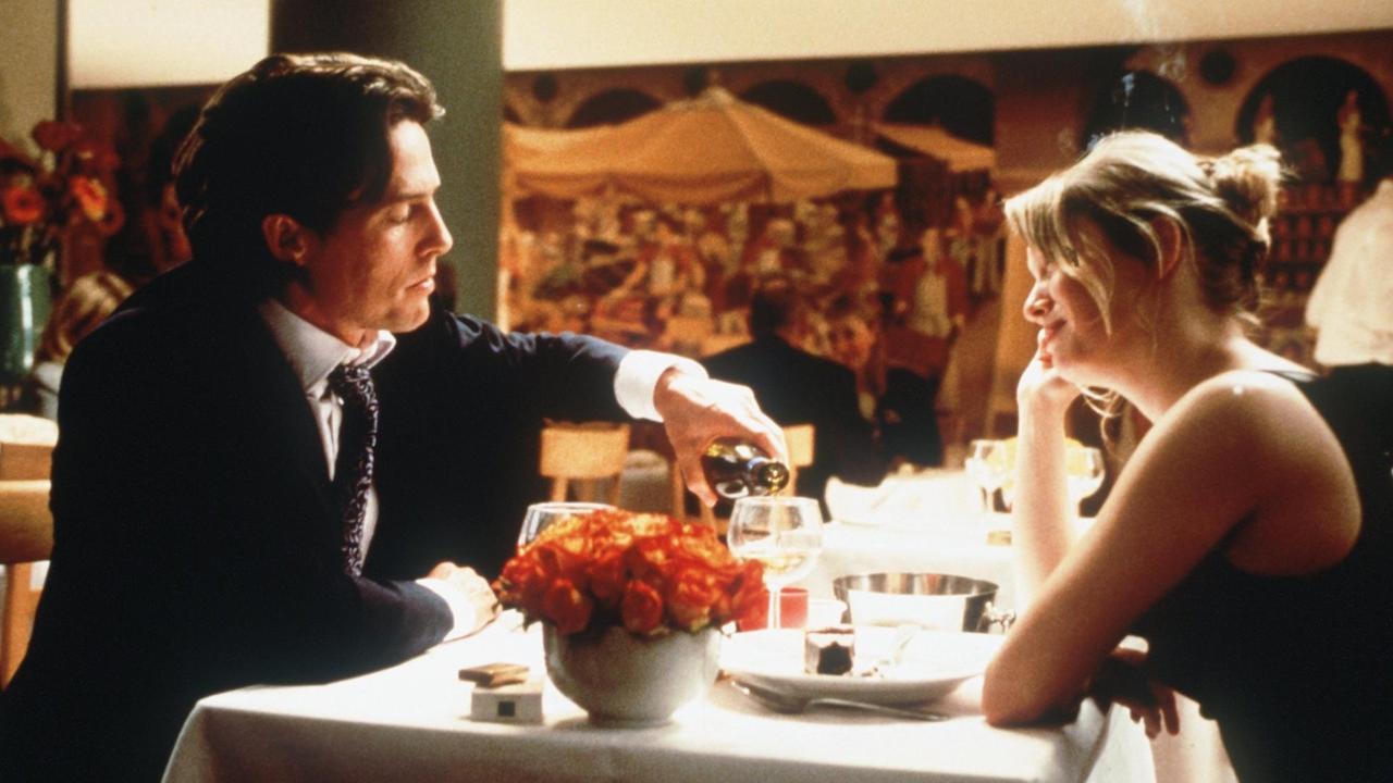 Die junge Bridget Jones (Renee Zellweger) lässt sich im neuen Kinofilm "Bridget Jones - Schokolade zum Frühstück" von ihrem Chef und späteren Freund Daniel Cleaver (Hugh Grant) zum Essen ausführen.