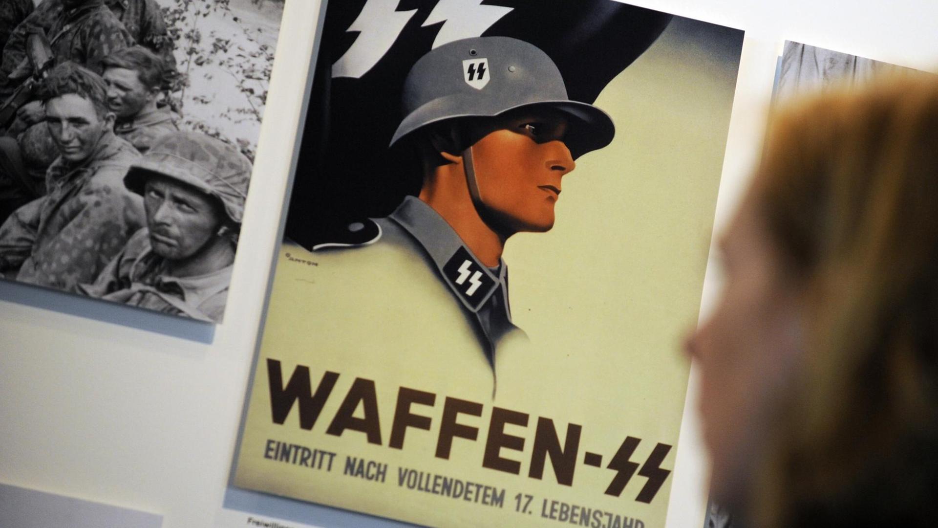 Ein Plakat der Waffen-SS in der Ausstellung des neuen NS-Dokumentationszentrums "Topographie des Terrors". Ein Plakat der Waffen-SS in der Ausstellung des neuen NS-Dokumentationszentrums "Topographie des Terrors".