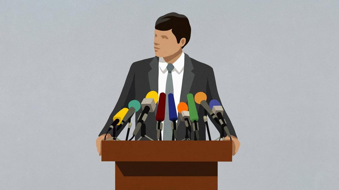 Illustration: Ein Politiker an einem Pult spricht in viele Mikrofone. Illustration: Ein Politiker an einem Pult spricht in viele Mikrofone.