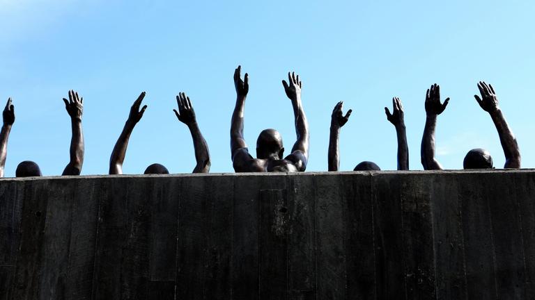 MONTGOMERY, AL - JULY 06: Hank Willis Thomas' 'Raise Up' statue, which depicts contemporary issues of police violence and racially biased criminal justice, stands inside The National Memorial For Peace And Justice in Montgomery, Alabama on July 6, 2018. MANDATORY MENTION OF THE ARTIST UPON PUBLICATION - RESTRICTED TO EDITORIAL USE. (Photo By Raymond Boyd/Getty Images)