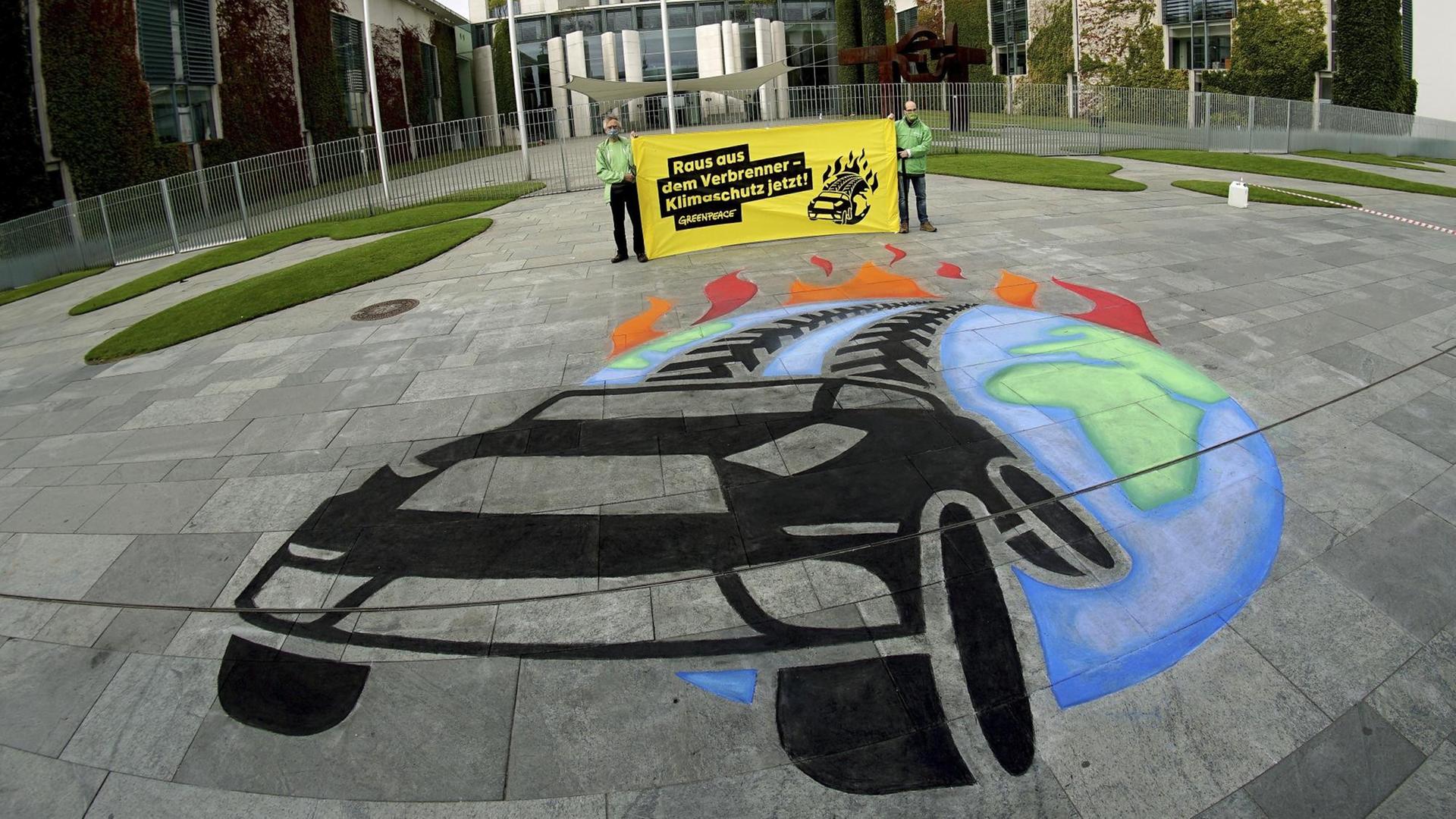 Ein-Greenpeace-Bild gegen Luftverschmutzung auf dem Asphalt vor dem Bundeskanzleramt in Berlin Ein-Greenpeace-Bild gegen Luftverschmutzung auf dem Asphalt vor dem Bundeskanzleramt in Berlin
