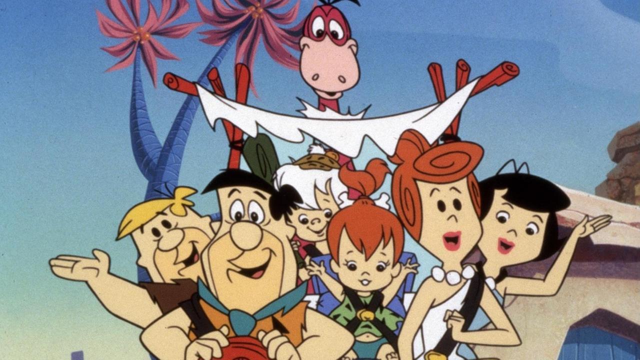 Filmstill aus der Zeichentrickserie "The Flintstones": Barney Rubble, Fred Flintstone, Bam Bam Rubble, Dinosaurier Dino, Pebbles Flintstone, Wilma Flintstone und Betty. Filmstill aus der Zeichentrickserie "The Flintstones": Barney Rubble, Fred Flintstone, Bam Bam Rubble, Dinosaurier Dino, Pebbles Flintstone, Wilma Flintstone und Betty.