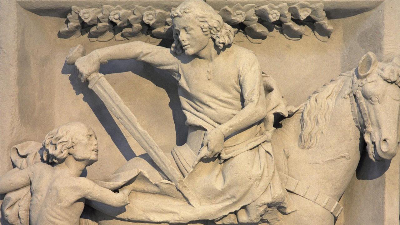 Skulptur, Naumburger Meister, vor 1239. - Die Mantelteilung des Heiligen Martin von Tours, sogenannter Bassenheimer Reiter. - Abguss des Sandsteinreliefs in der katholischen Pfarrkirche St. Martin in Bassenheim bei Koblenz Skulptur, Naumburger Meister, vor 1239. - Die Mantelteilung des Heiligen Martin von Tours, sogenannter Bassenheimer Reiter. - Abguss des Sandsteinreliefs in der katholischen Pfarrkirche St. Martin in Bassenheim bei Koblenz