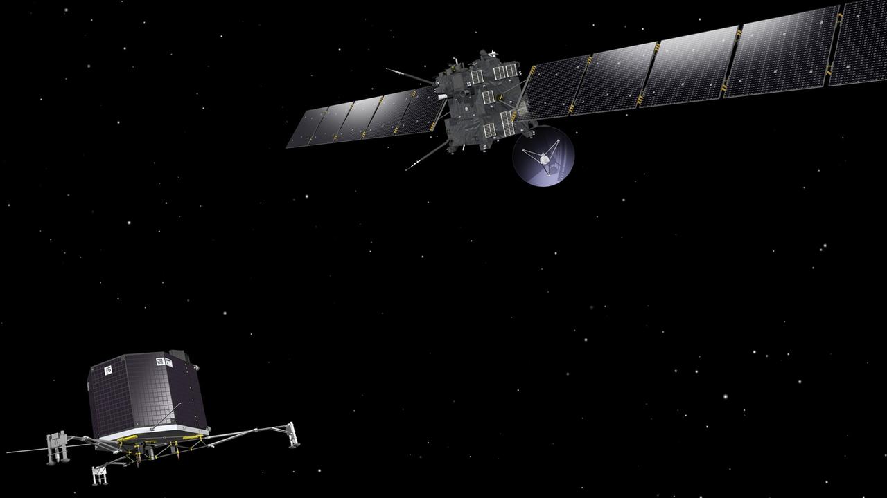 Die Raumsonde Rosetta und der Lander Philae schweben über der Kometenoberfläche von 67P. Künstlerische Darstellung eines Illustrators. Die Raumsonde Rosetta und der Lander Philae schweben über der Kometenoberfläche von 67P. Künstlerische Darstellung eines Illustrators.