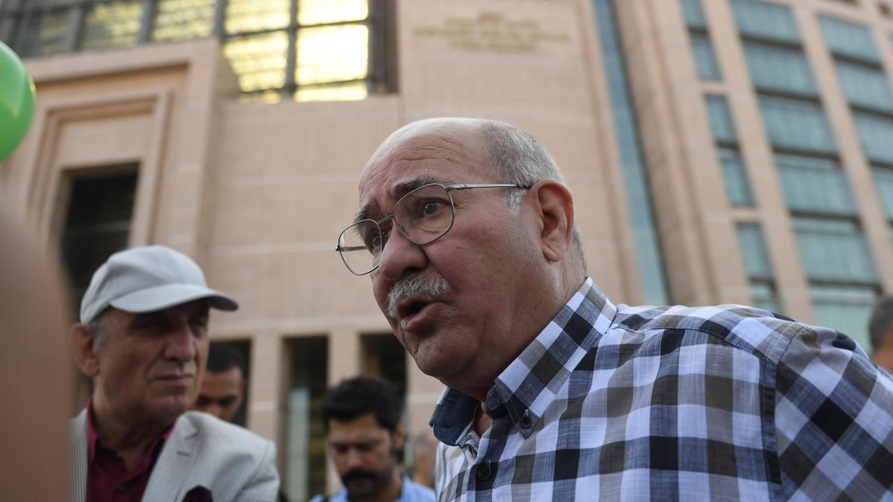 Writer for Turkish daily newspaper Cumhuriyet, Aydin Engin, speaks to AFP during a demonstration on July 24, 2017 outside Istanbul's courthouse, where journalists and directors of Turkish daily newspaper Cumhuriyet are on trial. Seventeen directors and journalists from Cumhuriyet, one of Turkey's most respected opposition newspapers, go on trial on July 24 after spending over eight months behind bars in a case which has raised new alarm over press freedoms under President Recep Tayyip Erdogan Writer for Turkish daily newspaper Cumhuriyet, Aydin Engin, speaks to AFP during a demonstration on July 24, 2017 outside Istanbul's courthouse, where journalists and directors of Turkish daily newspaper Cumhuriyet are on trial. Seventeen directors and journalists from Cumhuriyet, one of Turkey's most respected opposition newspapers, go on trial on July 24 after spending over eight months behind bars in a case which has raised new alarm over press freedoms under President Recep Tayyip Erdogan