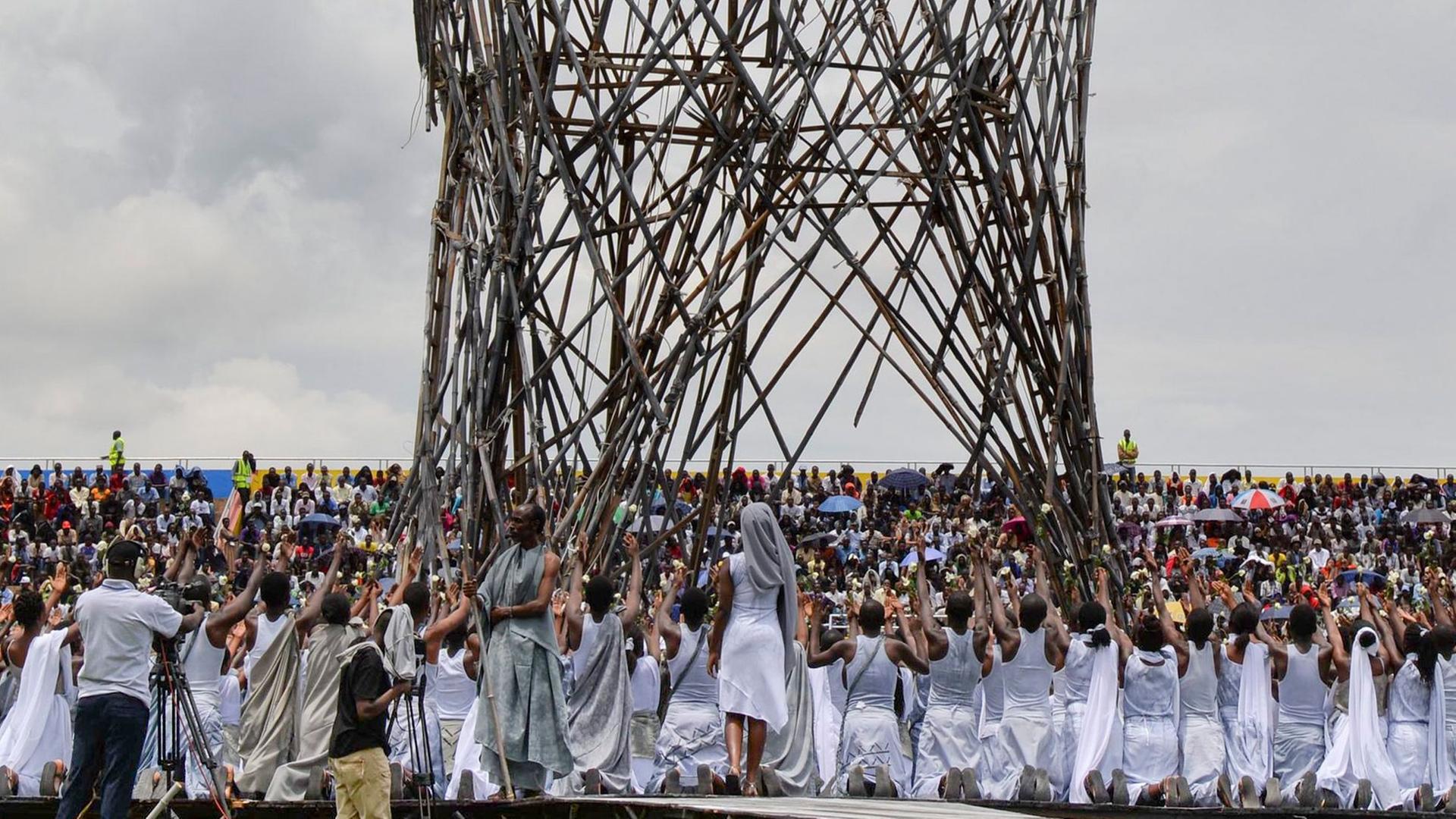 Performers pray in commemoration during an event to commemorate the 20th anniversary of the Rwandan genocide at Amahoro stadium in the capital Kigali, Rwanda, 07 April 2014. Performers pray in commemoration during an event to commemorate the 20th anniversary of the Rwandan genocide at Amahoro stadium in the capital Kigali, Rwanda, 07 April 2014.