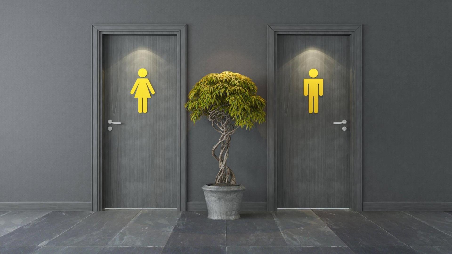 Zwei Türen mit jeweils einem gelben Zeichen, welches für Männer oder Frauen stehen soll. Dazwischen steht eine Pflanze. Zwei Türen mit jeweils einem gelben Zeichen, welches für Männer oder Frauen stehen soll. Dazwischen steht eine Pflanze.