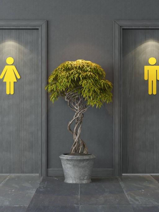 Zwei Türen mit jeweils einem gelben Zeichen, welches für Männer oder Frauen stehen soll. Dazwischen steht eine Pflanze.