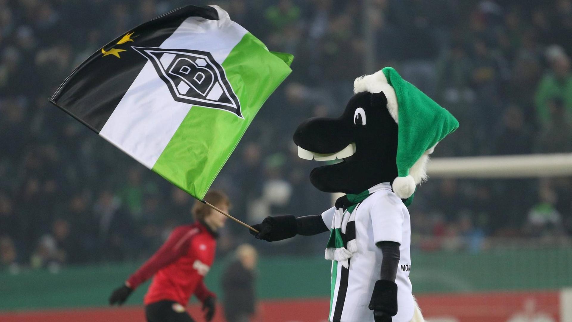 Das Maskottchen von Borussia Moenchengladbach Juenter schwenkt eine Fahne beim Spiel Borussia Moenchengladbach vs. Bayer 04 Leverkusen, Fussballplatz Das Maskottchen von Borussia Moenchengladbach Juenter schwenkt eine Fahne beim Spiel Borussia Moenchengladbach vs. Bayer 04 Leverkusen, Fussballplatz