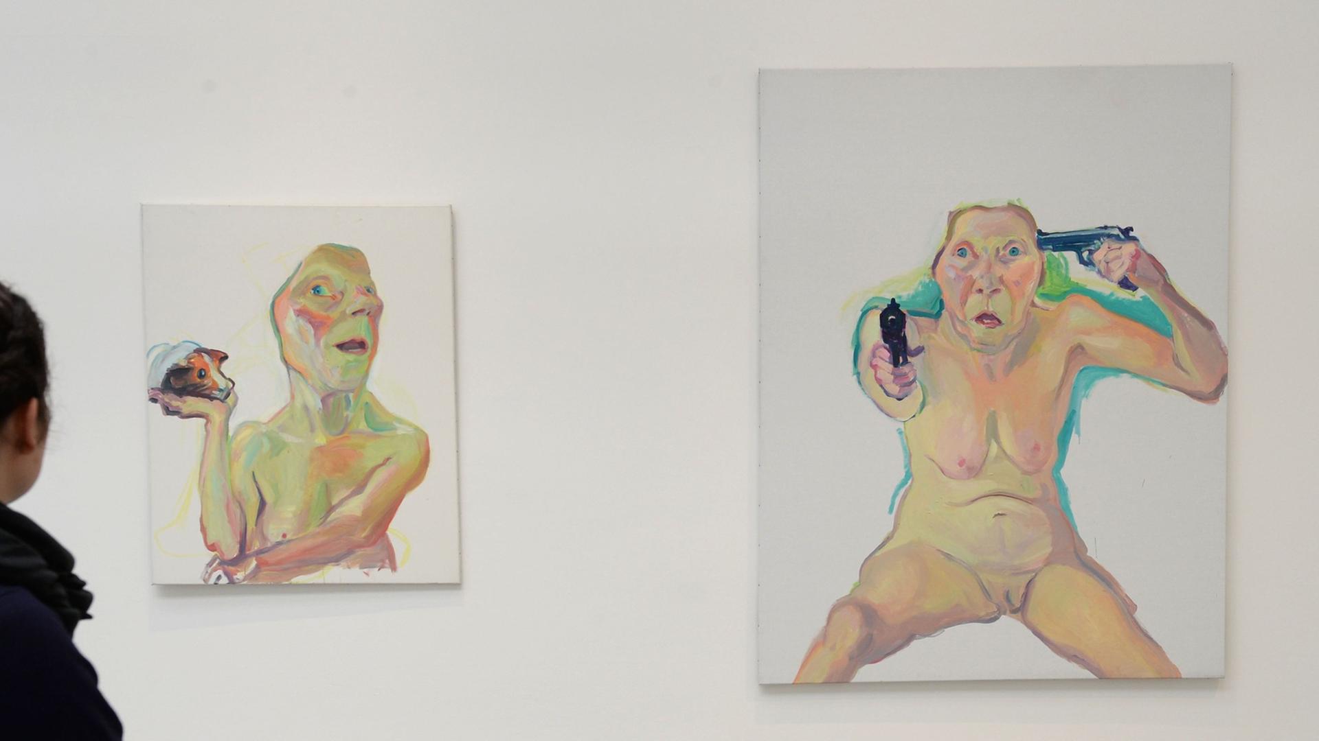 Die Arbeiten "Selbst mit Meerschweinchen" (l) und "Du oder Ich (You or me)" von Maria Lassnig nebeneinander an einer Museumswand. Die Arbeiten "Selbst mit Meerschweinchen" (l) und "Du oder Ich (You or me)" von Maria Lassnig nebeneinander an einer Museumswand.