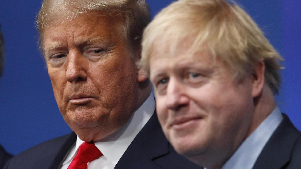 Die Köpfe von US-Präsident Donald Trump und dem britischen Premierminister Boris Johnson. Die Köpfe von US-Präsident Donald Trump und dem britischen Premierminister Boris Johnson.