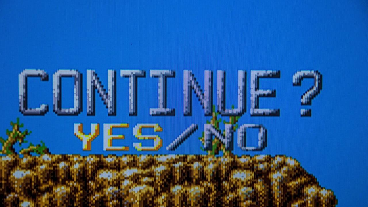 Klassisches Videospiel in Pixelgrafik fragt, ob man weiterspielen möchte: Continue Yes No. Klassisches Videospiel in Pixelgrafik fragt, ob man weiterspielen möchte: Continue Yes No.