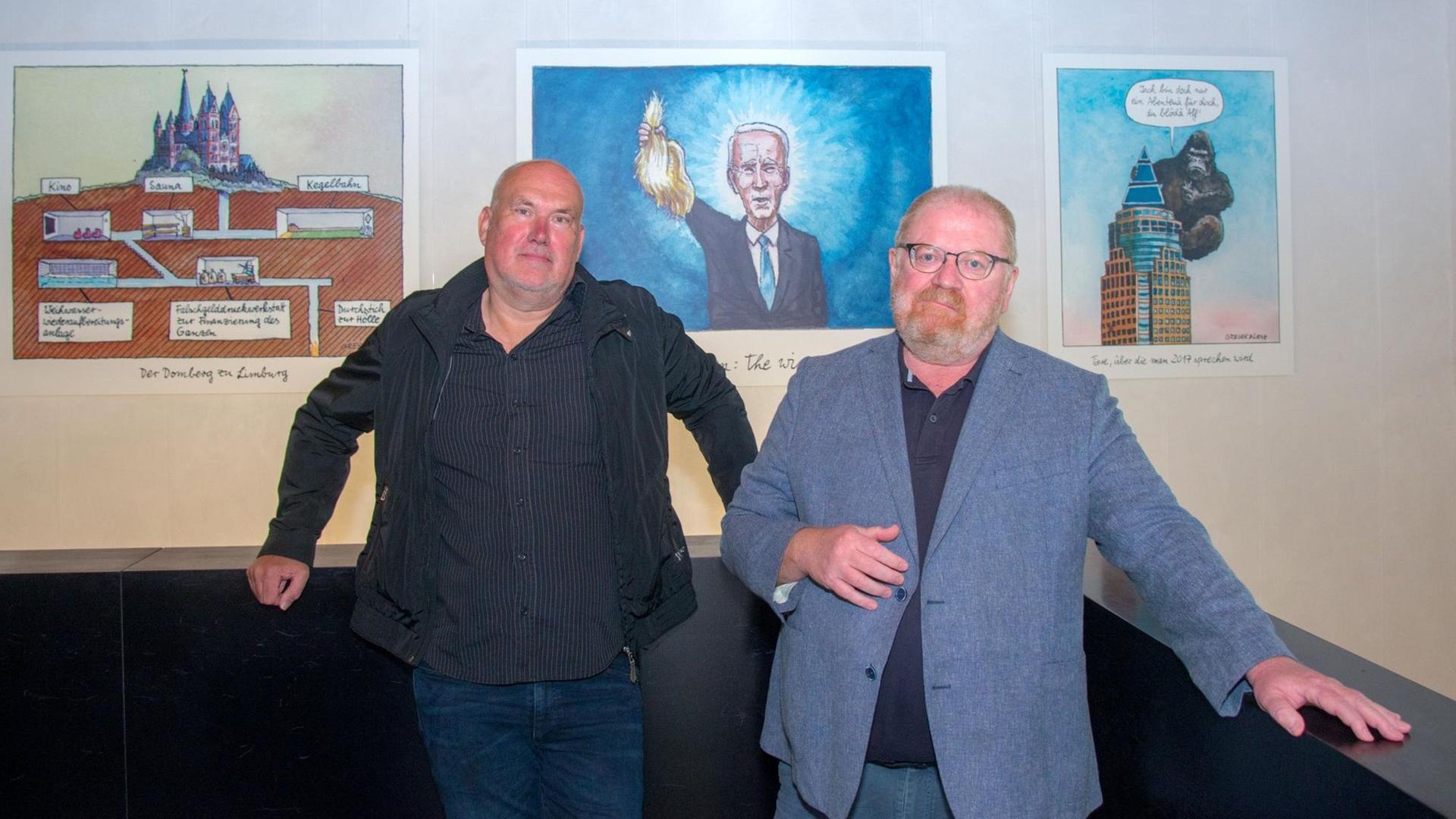 Die Zeichner Achim Greser und Heribert Lenz stehen in der Ausstellung "Ein Vierteljahrhundert Witze für Deutschland" Die Zeichner Achim Greser und Heribert Lenz stehen in der Ausstellung "Ein Vierteljahrhundert Witze für Deutschland"