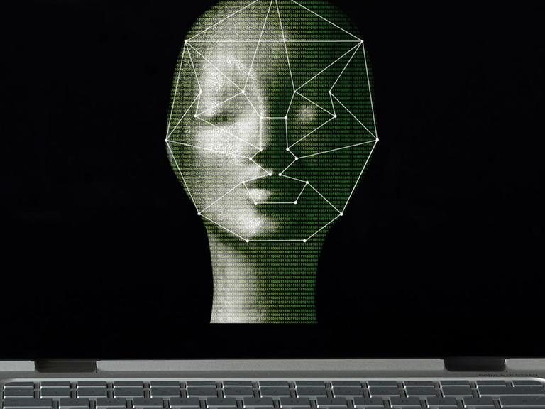 Das Foto zeigt einen Computer-Bildschirm, auf dem ein menschliches Gesicht biometrisch vermessen wird.