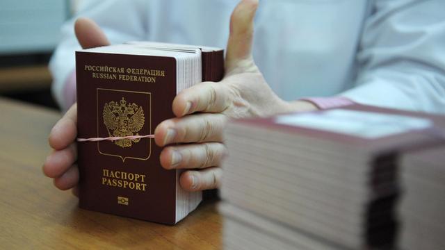 1347103 Russia, Moscow. 01/21/2013 FSUE Goznak staff member packs blank biometric passports ready to send to Russian citizens in the Reserve personalization center in Moscow. Grigoriy Sisoev/RIA Novosti |