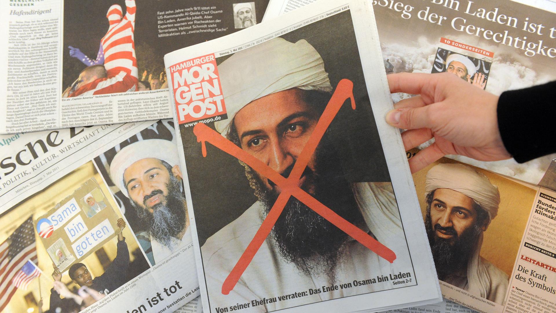 Der von einem amerikanischen Sonderkommando getötete Al-Kaida-Führer Osama bin Laden ist auf verschiedenen Titelseiten deutscher Tageszeitungen zu sehen. Der von einem amerikanischen Sonderkommando getötete Al-Kaida-Führer Osama bin Laden ist auf verschiedenen Titelseiten deutscher Tageszeitungen zu sehen.