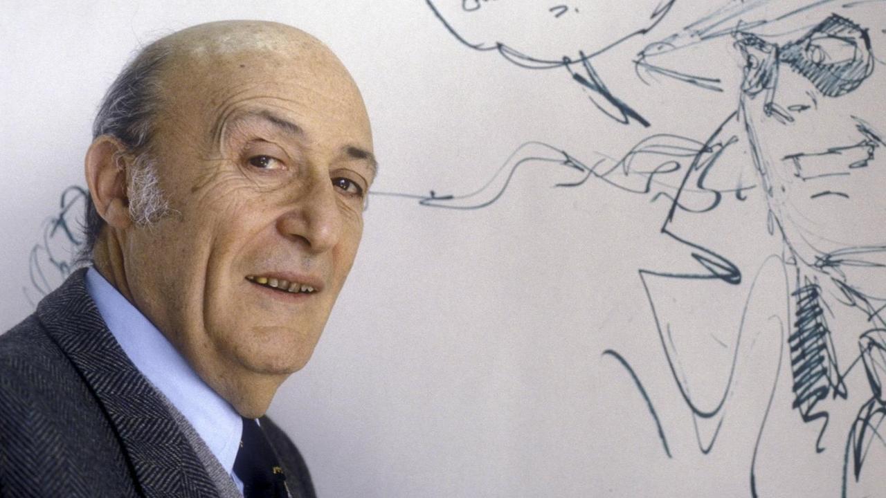 Der Comiczeichner Will Eisner schaut in die Kamera. Im Hintergrund ist ein Zeichnung zu sehen. Der Comiczeichner Will Eisner schaut in die Kamera. Im Hintergrund ist ein Zeichnung zu sehen.
