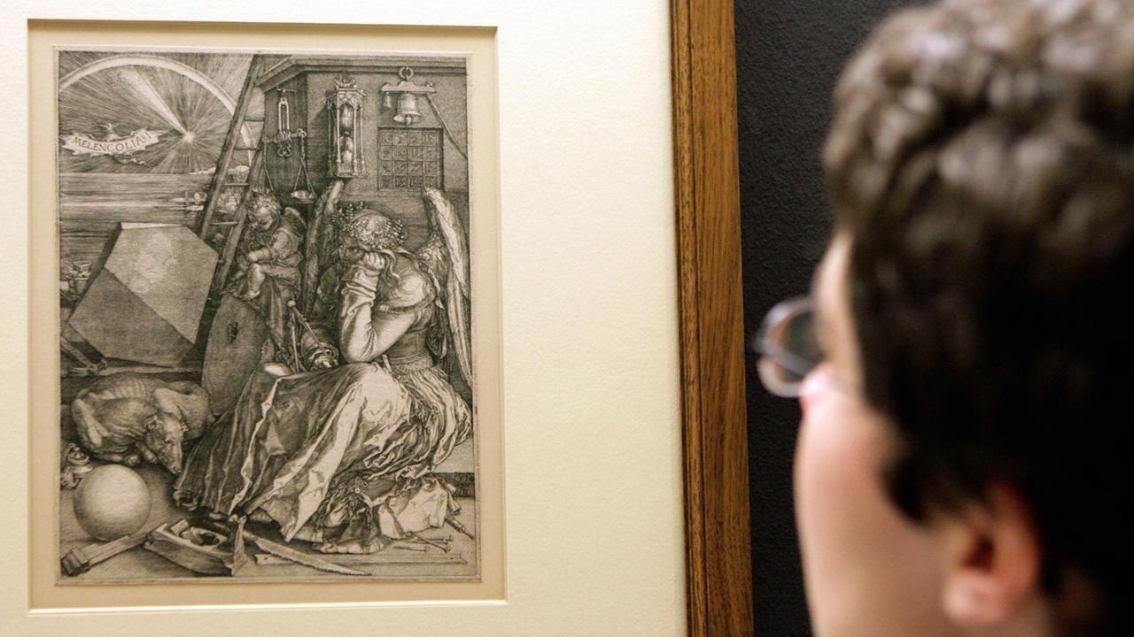 Eine Frau betrachtet am Donnerstag (16.02.2006) in der Neuen Nationalgalerie in Berlin das Bild "Melancholia" von Albrecht Dürer. Das Kunstwerk ist Teil der Ausstellung "Melancholie. Genie und Wahnsinn in der Kunst" die von Freitag (17.02.2006) bis zum 07.05.2006 in der Neuen Nationalgalerie in Berlin fast 400 Gemälde und Skulpturen aus zwei Jahrtausenden zeigt. Eine Frau betrachtet am Donnerstag (16.02.2006) in der Neuen Nationalgalerie in Berlin das Bild "Melancholia" von Albrecht Dürer. Das Kunstwerk ist Teil der Ausstellung "Melancholie. Genie und Wahnsinn in der Kunst" die von Freitag (17.02.2006) bis zum 07.05.2006 in der Neuen Nationalgalerie in Berlin fast 400 Gemälde und Skulpturen aus zwei Jahrtausenden zeigt.